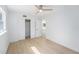 A bedroom with modern ceiling fan, and closet at 1601 Paloma Ln, Dunedin, FL 34698