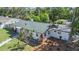 Charming single-story home with a well-maintained green roof and beautifully landscaped front yard at 1601 Paloma Ln, Dunedin, FL 34698