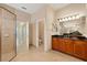 Bathroom vanity with a walk-in shower, and toilet area; all conveniently located in the home at 16055 Golden Lakes Dr, Wimauma, FL 33598