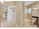 Bright bathroom with tiled shower/tub combination and neutral decor in a well-lit space at 16055 Golden Lakes Dr, Wimauma, FL 33598