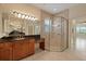 Bathroom showcasing a large vanity, beautiful shower, and ample counter space in the home at 16055 Golden Lakes Dr, Wimauma, FL 33598