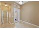 Flex space with an open doorway, tile floors, and neutral paint at 16055 Golden Lakes Dr, Wimauma, FL 33598