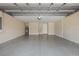 Spacious three car garage has epoxy flooring, water heater and lots of room for storage at 16055 Golden Lakes Dr, Wimauma, FL 33598