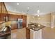 Kitchen featuring stainless appliances, granite countertops, and an island with seating at 16055 Golden Lakes Dr, Wimauma, FL 33598