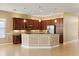 Well-equipped kitchen featuring stainless steel appliances, granite countertops, and abundant cabinet space at 16055 Golden Lakes Dr, Wimauma, FL 33598