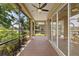 Relaxing screened patio has beautiful views of lush landscaping, lake and palm trees at 16055 Golden Lakes Dr, Wimauma, FL 33598