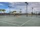 A community tennis court provides recreation and enjoyment in a scenic environment and shade for a rest in between games at 16055 Golden Lakes Dr, Wimauma, FL 33598