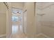 Walk-in closet boasting ample shelving and storage space, conveniently located near the Primary bedroom at 16055 Golden Lakes Dr, Wimauma, FL 33598