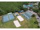 Community amenities featuring tennis courts, sand volleyball and recreational areas for residents' enjoyment and activities at 1624 Maximilian Dr, Wesley Chapel, FL 33543