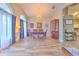 Formal dining room with tile floors, elegant lighting, and seating for six at 1624 Maximilian Dr, Wesley Chapel, FL 33543