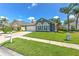 Inviting one-story home with lush lawn, pretty landscaping and attached two car garage at 1624 Maximilian Dr, Wesley Chapel, FL 33543