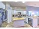 Modern kitchen featuring granite countertops, island, stainless appliances and ample cabinet space at 1624 Maximilian Dr, Wesley Chapel, FL 33543