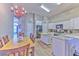 Open kitchen featuring granite countertops, island, stainless appliances and ample cabinet space at 1624 Maximilian Dr, Wesley Chapel, FL 33543