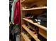 Organized closet space with shelves displaying shoes and neatly arranged clothes at 17127 Brown Rd, Odessa, FL 33556