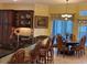 Open dining area with seating for six and built-in cabinets at 17127 Brown Rd, Odessa, FL 33556