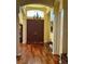Inviting foyer with hardwood floors, high ceilings, a chandelier, and large double doors at 17127 Brown Rd, Odessa, FL 33556