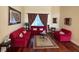 Cozy living room featuring plush sofas, hardwood floors, and elegant decor at 17127 Brown Rd, Odessa, FL 33556