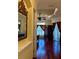 Elegant main bedroom with hardwood floors, ceiling fan, and decorative mirror at 17127 Brown Rd, Odessa, FL 33556
