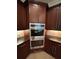 Elegant kitchen with built in double ovens and granite countertops at 17127 Brown Rd, Odessa, FL 33556