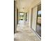 Enclosed patio featuring tile flooring, sliding glass doors, and a view of the property at 17127 Brown Rd, Odessa, FL 33556