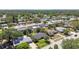 Residential neighborhood showcasing well-maintained homes with mature trees and green spaces, near a lake at 1751 Ashton Abbey Rd, Clearwater, FL 33755