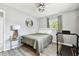 Light bedroom features a window, a ceiling fan, and an ensuite treadmill at 1751 Ashton Abbey Rd, Clearwater, FL 33755