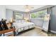 Comfortable bedroom with natural light, neutral walls, and wood-look flooring at 1751 Ashton Abbey Rd, Clearwater, FL 33755
