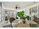 Inviting sunroom filled with natural light, and with a table for dining, enhancing the living experience at 1751 Ashton Abbey Rd, Clearwater, FL 33755