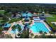 Community features include a pool, water slide, clubhouse, tennis courts, and lovely landscaping at 19116 Nature Palm Ln, Tampa, FL 33647