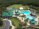 Aerial view of the community clubhouse, pool, sports courts, and manicured landscaping at 19116 Nature Palm Ln, Tampa, FL 33647