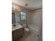 Bathroom with vanity, toilet and tub/shower combination at 19116 Nature Palm Ln, Tampa, FL 33647