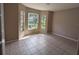 Bedroom with large windows and neutral paint at 19116 Nature Palm Ln, Tampa, FL 33647
