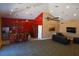 Spacious common area offering a kitchen and lounge with flat screen TV, providing a great space for entertaining and relaxation at 19116 Nature Palm Ln, Tampa, FL 33647