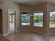 Breakfast nook featuring direct access to the lanai and views of the pool area at 19116 Nature Palm Ln, Tampa, FL 33647