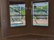 Breakfast nook area with windows overlooking a pool and lush greenery at 19116 Nature Palm Ln, Tampa, FL 33647