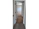Hallway leading to an open room with hardwood floors at 19116 Nature Palm Ln, Tampa, FL 33647