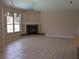 Spacious living room featuring a stone fireplace and neutral flooring at 19116 Nature Palm Ln, Tampa, FL 33647