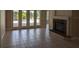 Living room boasting tile flooring, a fireplace, and French doors leading to outdoor views providing a seamless living space at 19116 Nature Palm Ln, Tampa, FL 33647
