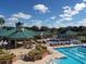 Community pool with lap lanes, lounge chairs, and inviting gathering spaces at 19116 Nature Palm Ln, Tampa, FL 33647