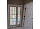 Bright sunroom with glass paneled doors and natural light at 19116 Nature Palm Ln, Tampa, FL 33647