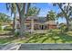 An inviting backyard with a covered patio and a lake view, perfect for outdoor gatherings at 19254 Blount Rd, Lutz, FL 33558