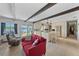 Kitchen featuring stainless appliances and views of the water, with a comfortable seating arrangement at 19254 Blount Rd, Lutz, FL 33558