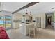 Modern kitchen with stainless steel appliances, an island, and a view of the lake at 19254 Blount Rd, Lutz, FL 33558