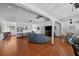 Spacious living room with hardwood floors, large sectional sofa and entertainment area at 19254 Blount Rd, Lutz, FL 33558