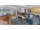 Living room with lake views, hardwood floors, dining area, and an open floor plan at 19254 Blount Rd, Lutz, FL 33558