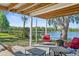 Tranquil patio with cozy seating and stunning views of the lake and surrounding nature at 19254 Blount Rd, Lutz, FL 33558