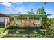 Exterior shot of the rustic shed, perfect for storage or a workshop at 19254 Blount Rd, Lutz, FL 33558