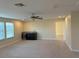 A large bonus room with a wet bar, a ceiling fan, and lots of natural light at 19514 Sea Myrtle Way, Tampa, FL 33647
