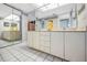 Bright bathroom with double vanity, tile flooring, and large mirror at 19925 Gulf Blvd # 503, Indian Shores, FL 33785