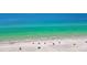 Stunning aerial shot of a pristine beach with crystal-clear water, inviting for relaxation and recreation at 19925 Gulf Blvd # 503, Indian Shores, FL 33785